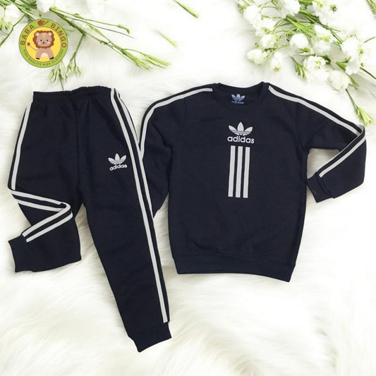 Elevate your style with our Unisex Adidas Track Suit! Made with high quality Fleece fabric, this sleek and comfortable suit is perfect for kids on the go. Stay warm and stylish while being active. Available for all genders.